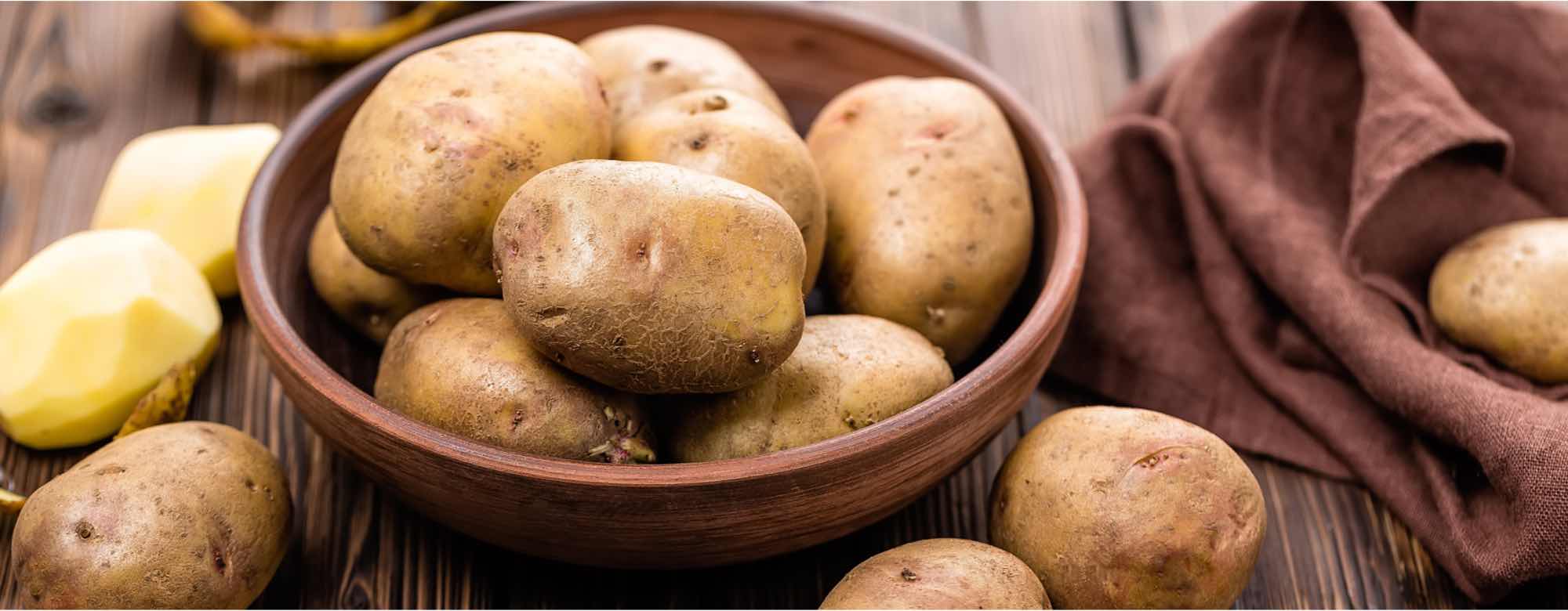 Image of raw potatoes in a bowl